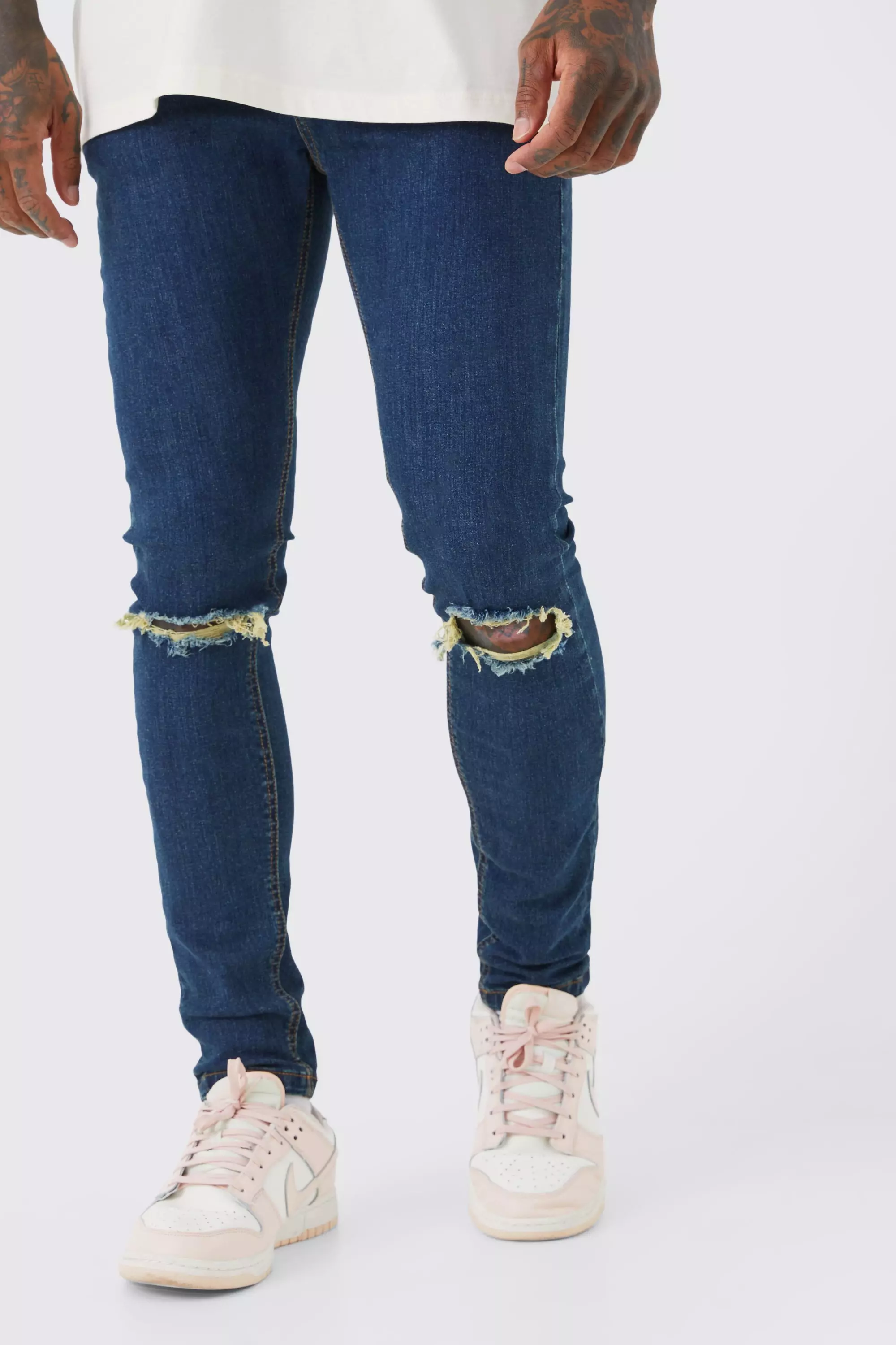 Distressed knee hot sale jeans